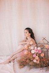 Portrait of beautiful girl in  flower gazebo