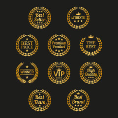 Set of golden laurel wreaths on black background.