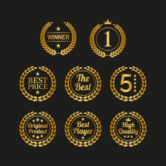 Set of golden laurel wreaths on black background.