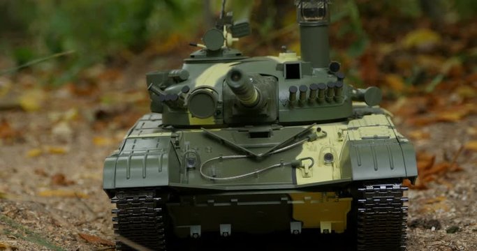 tank T-72  camouflage coloring front view, camera motion close to