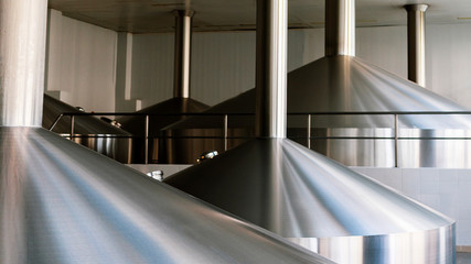 Steel fermentation vats on brewer factory. White background.
