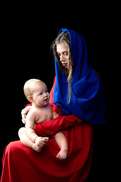 Mother with baby, motherhood concept. in the image of the madonna