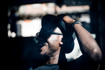 African man with hat and sunglasses