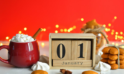 Wooden Calendar 1 JANUARY with Christmas and New Year Decorate on red background,wooden numbers...