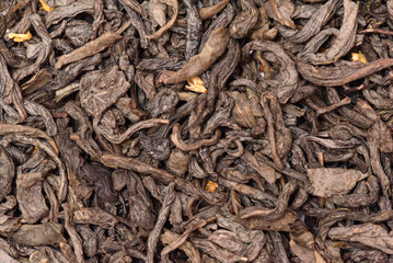 Dried herbal tea leaves texture background. Top view.