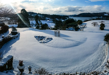 Snowy day in Windermere, Lake District. Snow on a cold winter in Cumbria, UK. 
