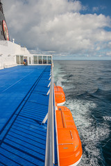 Naklejka na ściany i meble Smyril Line cruise ship and ferry boat is heading towards Faroe Islands and then Iceland, summer time, Atlantic ocean