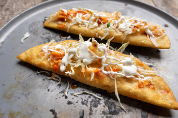 Mexican empanadas with cabbage and red sauce