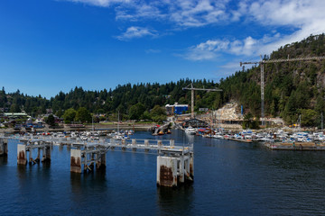 Fototapeta na wymiar Boats docked near the ferry terminal of Horseshoe bay, on the Pacific Ocean, BC, Canada