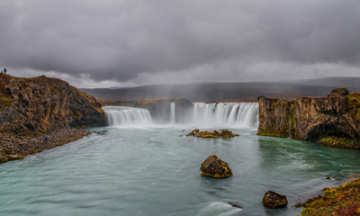 landscape of the Godafoss famous waterfall in Iceland. The breathtaking landscape of Godafoss waterfall attracts tourist to visit the Northeastern Region of Iceland. September 2019. Long exposure