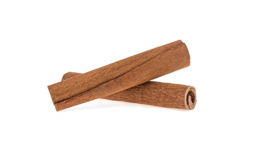 two cinnamon sticks on a white background isolated