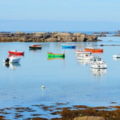 Yachts and boats during ocean low tide in Lilia, Brittany, France