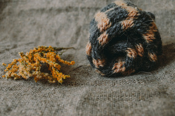 Knitted gloves with dried flowers. Handmade knitted ware 