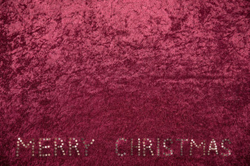 velvet cloth wine red background with merry christmas text