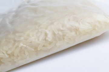 A bag of rice for instant cooking on a white background.