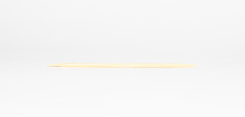 wooden toothpick on a white background