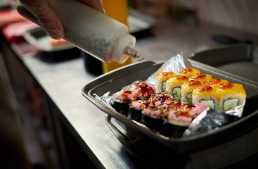 sushi master sprinkles sesame seeds rolls