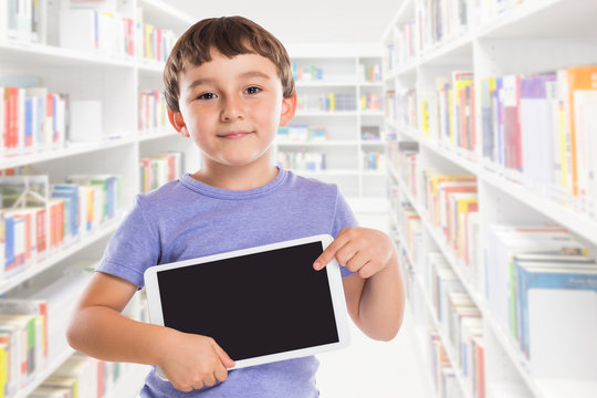 Young boy child pointing at tablet computer library information marketing ad advertising