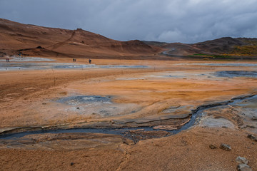 Hverir geothermal area in North Iceland. dy geysers and sulfur field. Orange mountains Iceland.