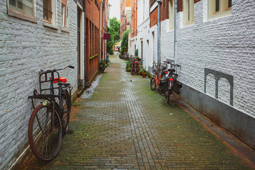 Bicycles in the narrow street in Amsterdam. Netherlands.