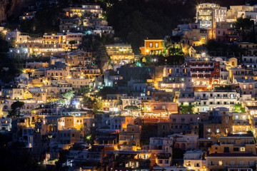 Fototapeta na wymiar Colorful houses of Positano along Amalfi coast at night, Italy.
