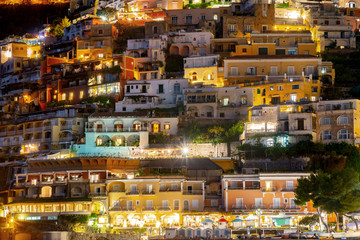 Colorful houses of Positano along Amalfi coast at night, Italy.