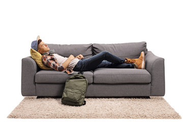 Male student sleeping on a sofa