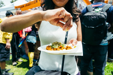 woman squeezing lime on taco