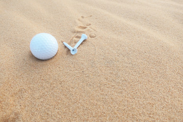 Fototapeta na wymiar Golf ball in sand at bunker