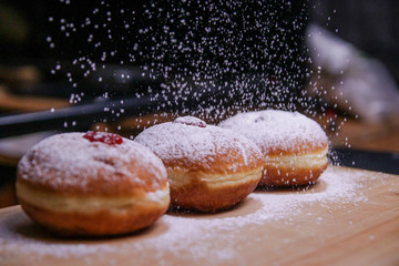 Hanukkah food doughnuts with jelly and sugar powder with bookeh background. Jewish holiday Hanukkah...