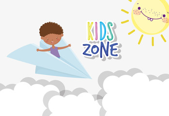kids zone, cute little boy playing in the paper plane sky sun