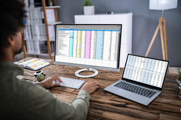 Businessman Analyzing Data On Computer