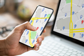 Fototapeta na wymiar Person Using GPS Navigation Map On Mobile Phone