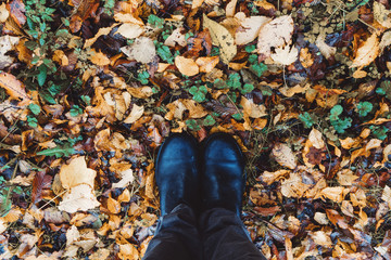 Feet - Boots on autumn leaves