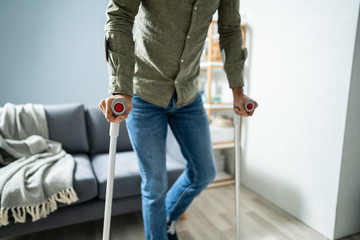 Man With Broken Leg Walking On Carpet