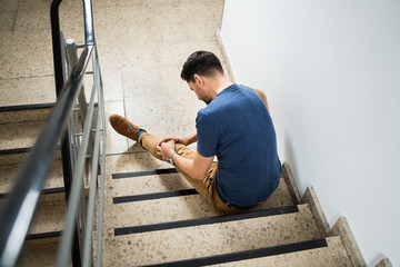Man Sitting On Staircase