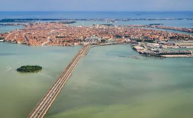 Venice, Italy - Panoramic aerial view. Top view of popular Venice on a sunny day from a window plane.