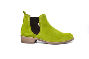 Female green leather boot on white background, isolated product, top view.