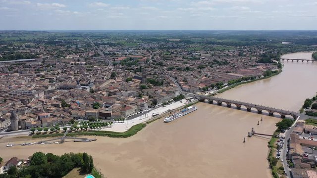 Panoramic aerial view of Libourne city on Dordogne river on sunny summer day, Gironde, France