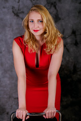 portrait of  blonde girl in red dress