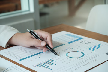 Business People Meeting Design Ideas  with pen analyzing financial documents professional investor working new start up project. 