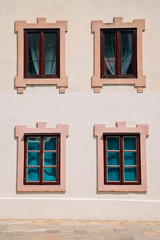 Fototapeta na wymiar Classic window on beige wall