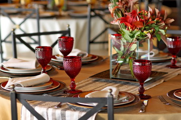 table arrangements with flowers, glasses and cutlery