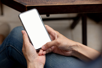 Mockup image blank white screen cell phone.men hand holding texting using mobile background empty space for advertise text.people contact marketing business and technology 