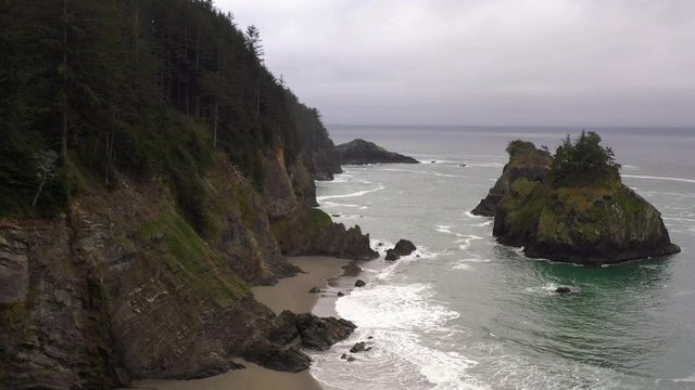 Drone flying over empty beach at scenic Southern Oregon Coast
