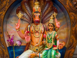 Colourful statues of Hindu religious deities in Hindu temple in Singapore	