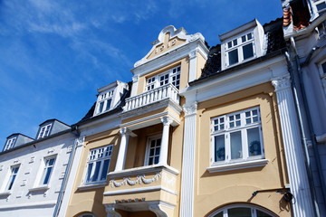 Fototapeta premium many old white and yellow stone houses in Rodby, Denmark