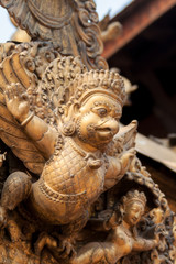 A gilded statue of Garuda, the half-man, half bird carrier of the Hindu god Vishnu.
