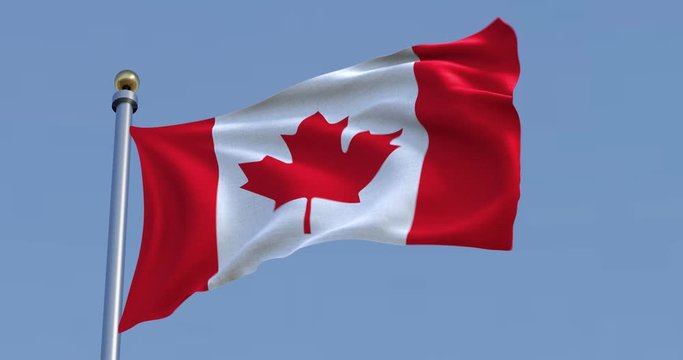 Canada flag in front of a clear blue sky