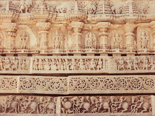 A wall covered in sculpted figures symbolising different historical events.